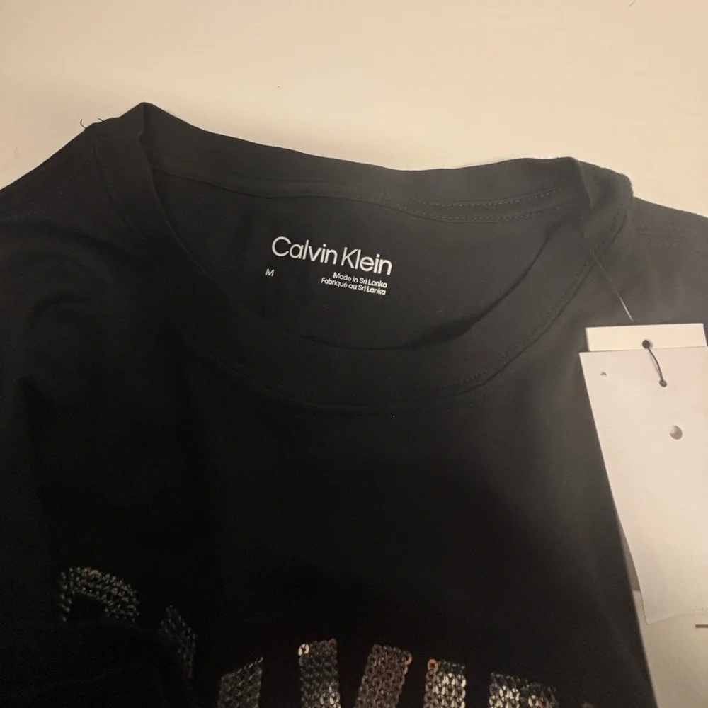 NWT Calvin Klein Black Tee with Silver Logo Print - Picture 5 of 8